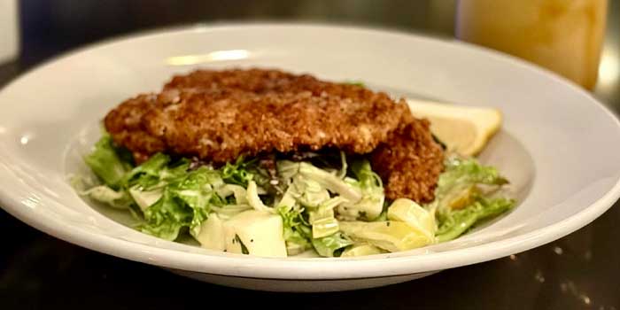 The Chicken Milanese entrée served on the Classic Interpretations menu from DeBlaze at 131 restaurant and bar in Carnegie PA