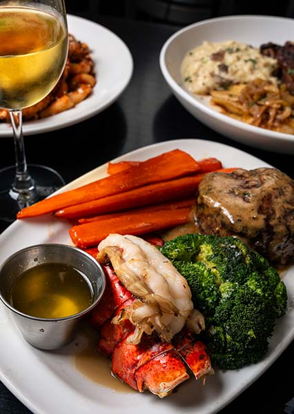Enjoy steak, lobster tail, and wine at DeBlaze at 131 Bar near Carnegie — a true culinary delight.